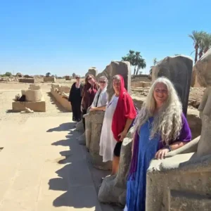 Spiritual tour group aligning with the ancient energy of Avenue of Sphinxes in Luxor Egypt